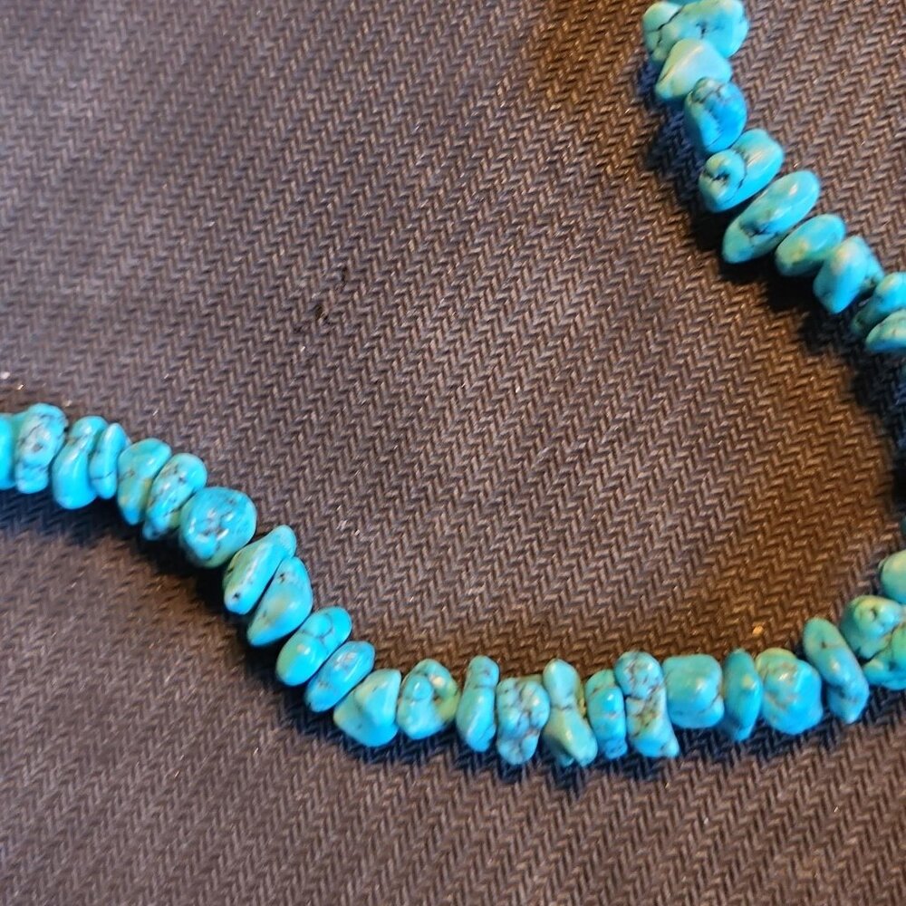 Turquoise Necklace with twisted closure. Measures 18 inches.